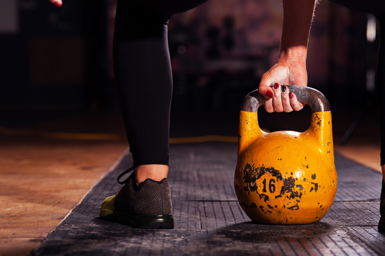 person-gripping-kettlebell